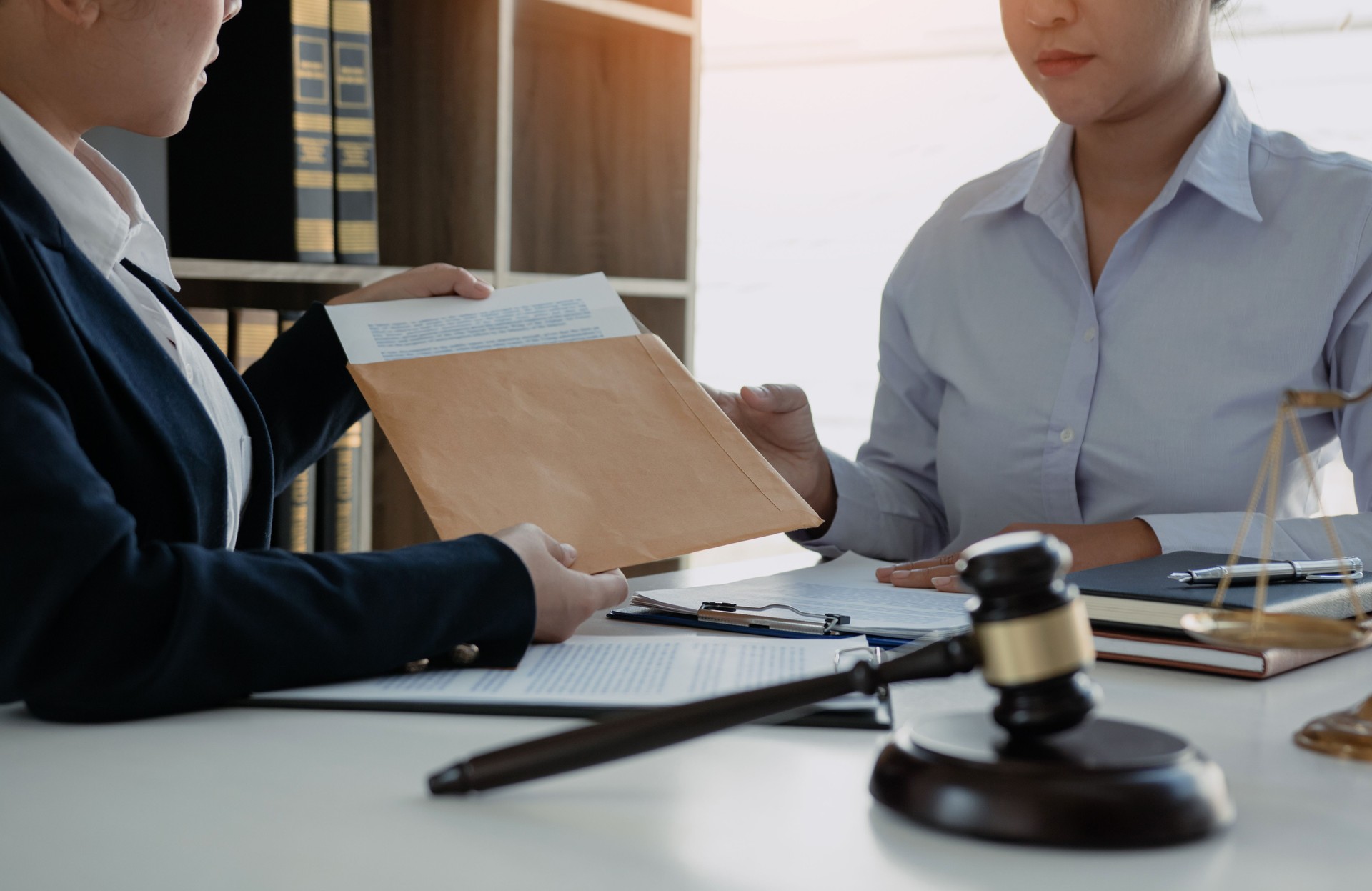 Client is submitting information on the paper of the prosecution document to the lawyer.
